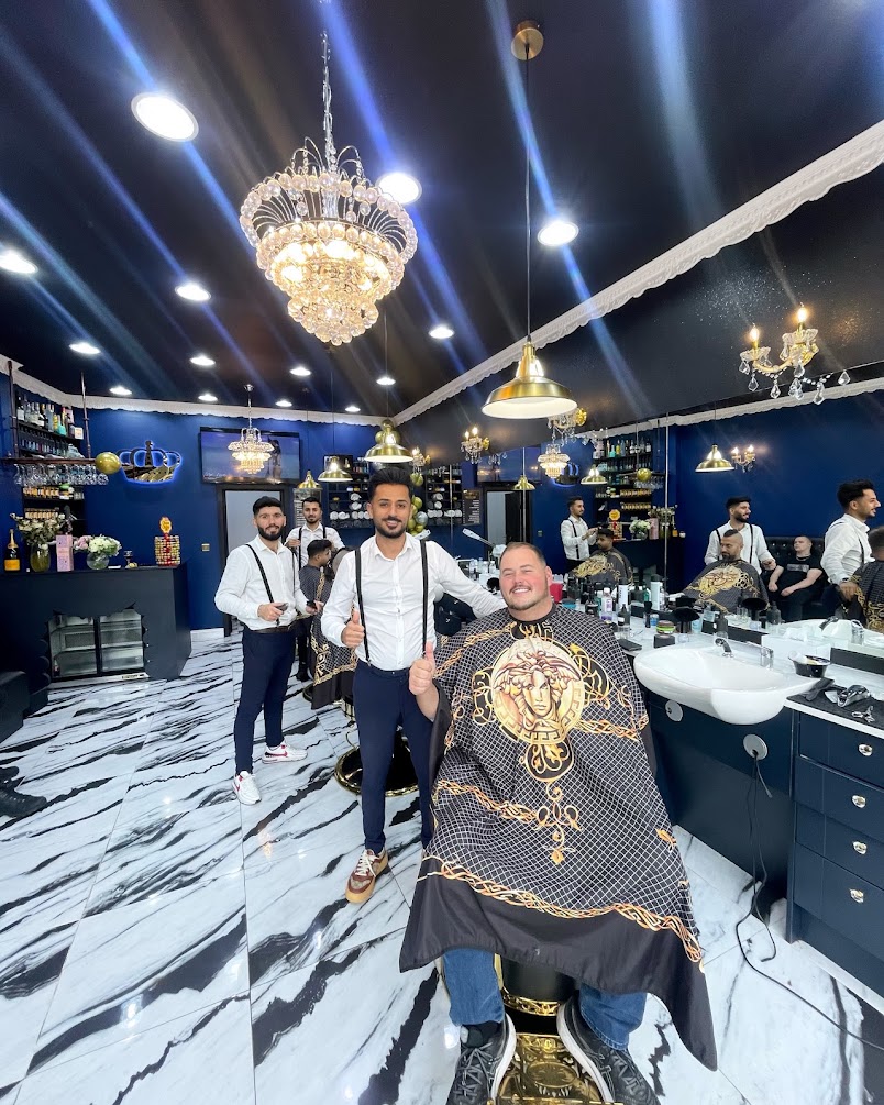 Inside Crown — chandelier, blue walls and gold chairs